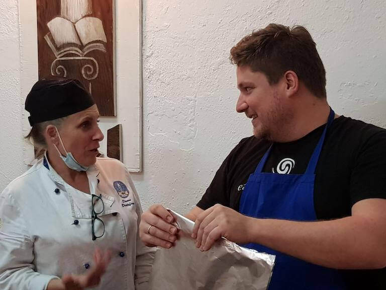 Chef Instructor Dawn DeStefano interacting with a culinary arts student at the Italian Culinary Institute in Staletti, Italy.
