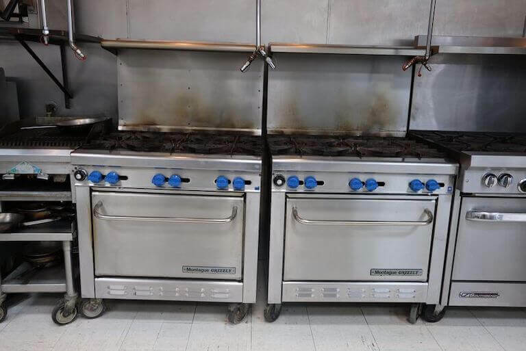 Commercial ovens inside a professional kitchen.