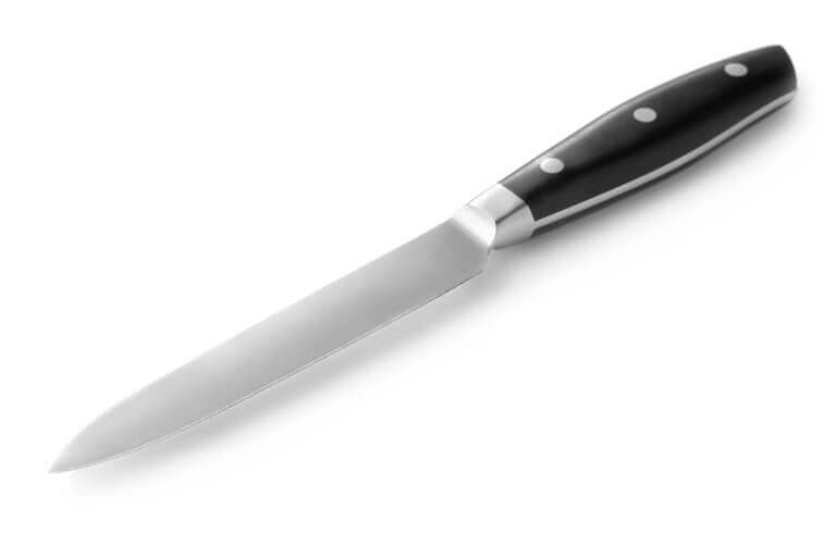 Closeup of a utility knife on white background.